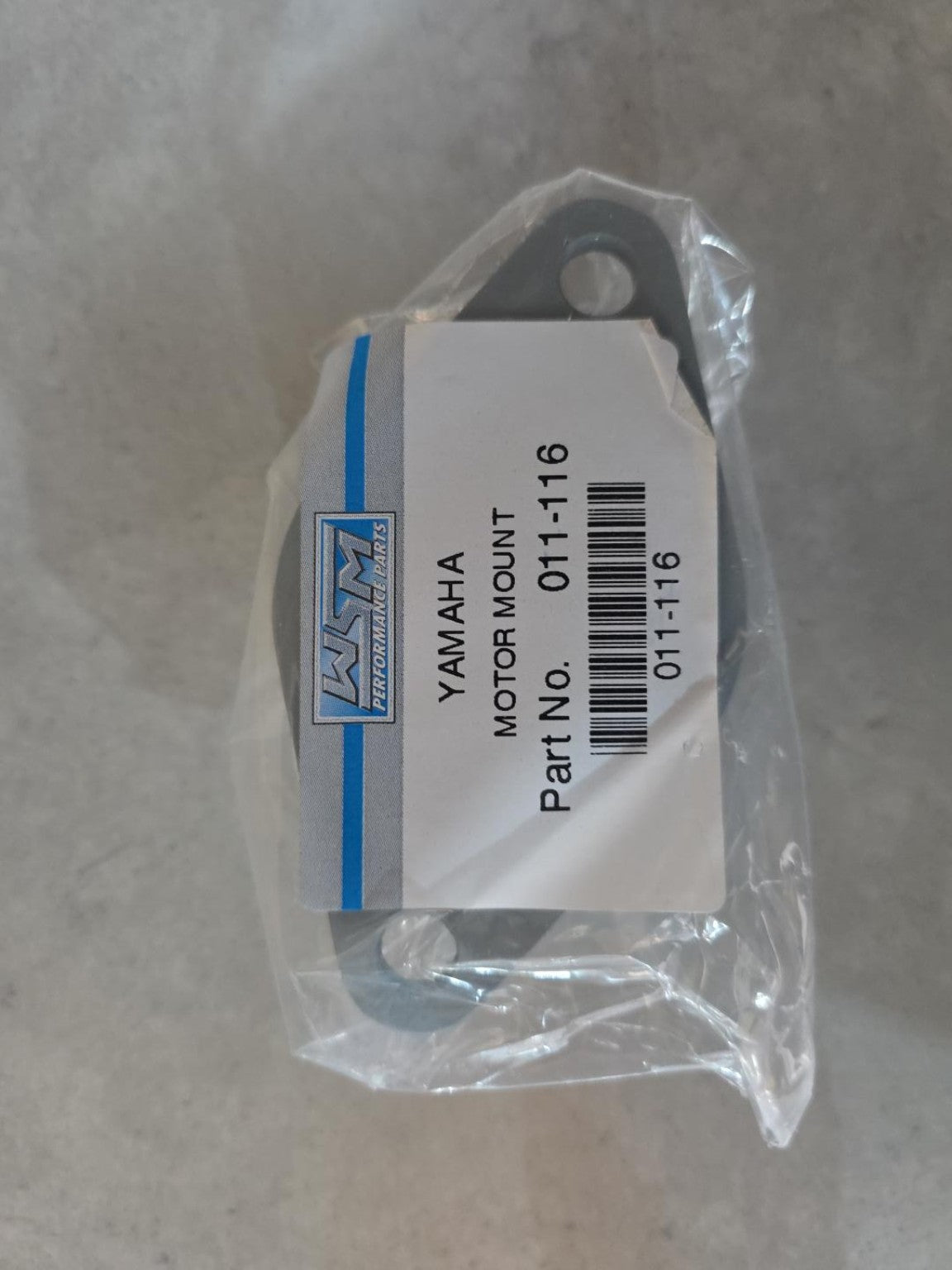Original WSM packaging label confirming Yamaha motor mount part number 011-116